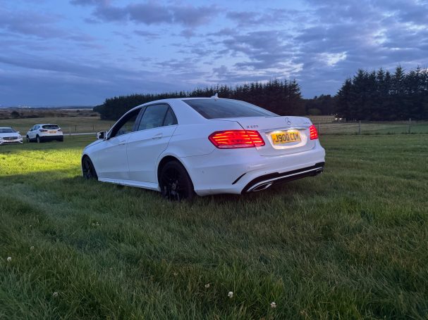 white mercedes on chauffuering job at trump international golf links