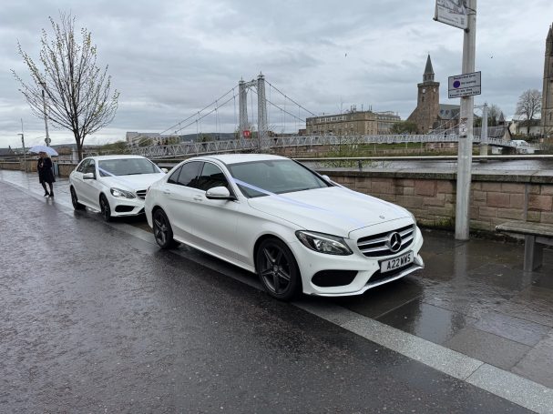 Two wedding cars alongside the River Ness in Inverness